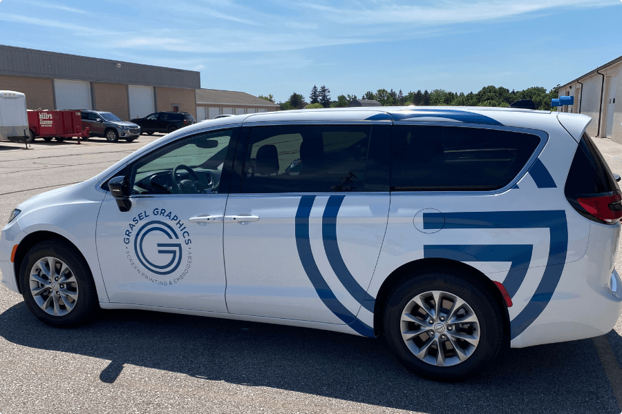 A white delivery van with the Grasel Graphics logo.